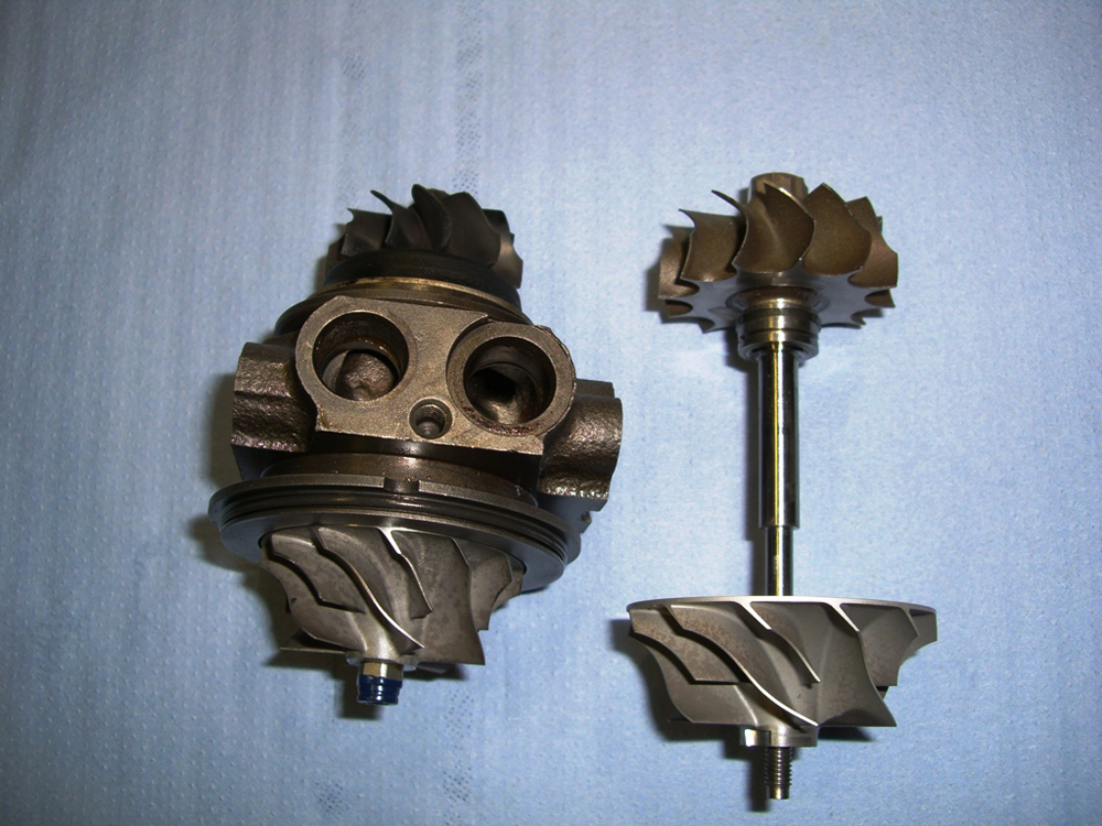 Name:  Old core assembly next to new shaft and compressor wheel.JPG
Views: 2158
Size:  544.4 KB